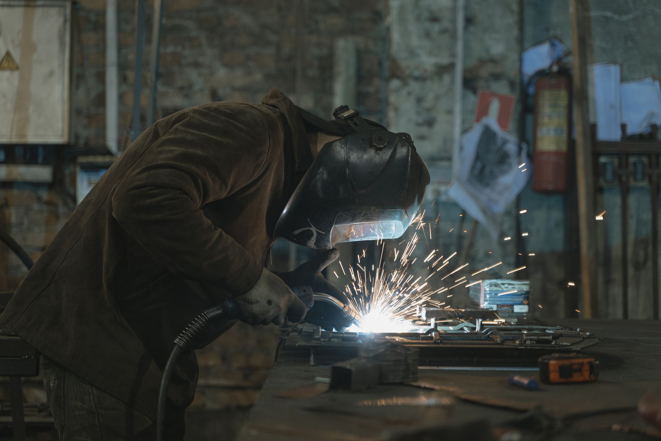 Fabricator welding steelwork in the workshop